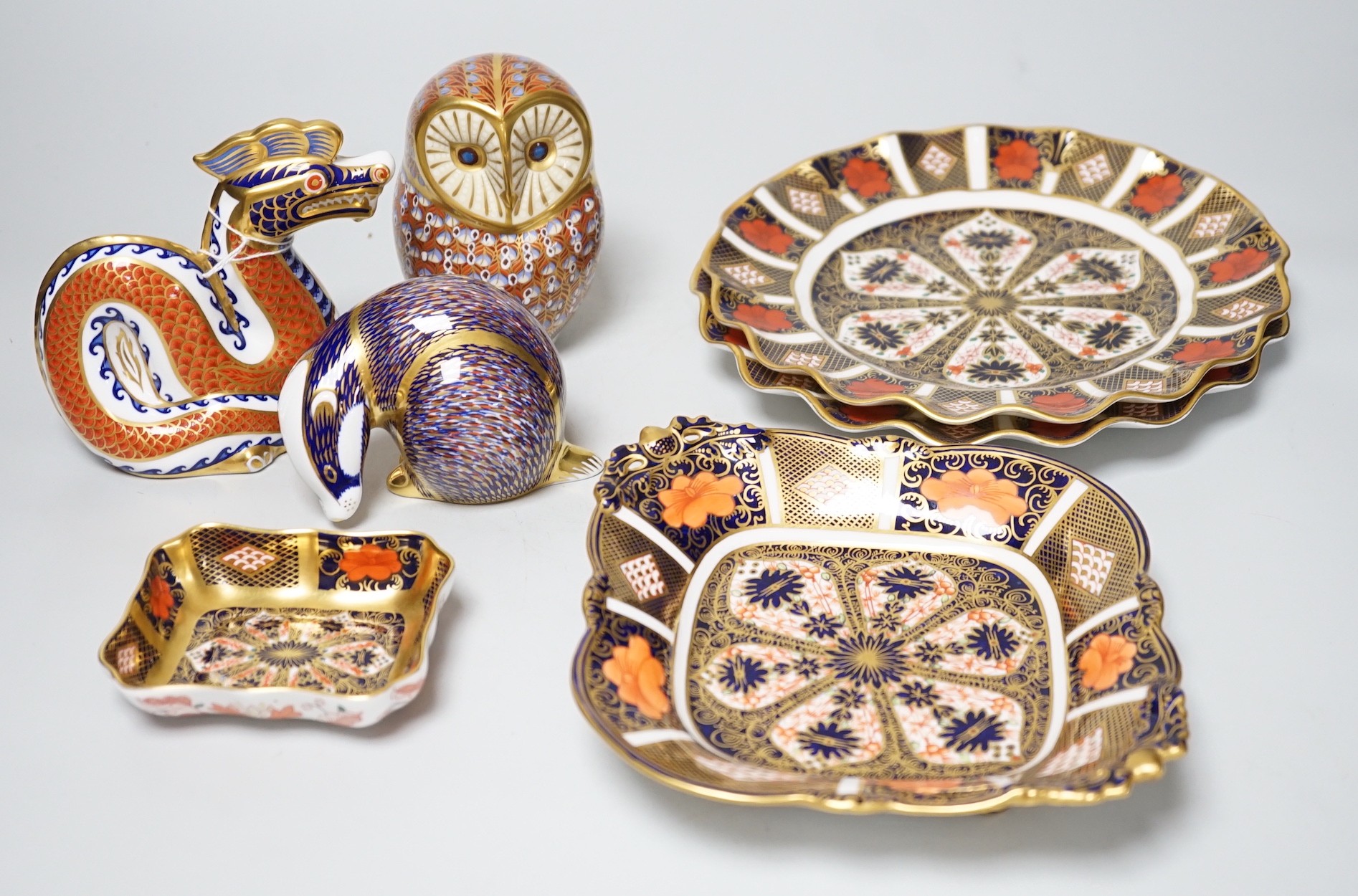 Four various Royal Crown Derby 1128-pattern dishes, plates 21cm, and three Royal Crown Derby paperweights